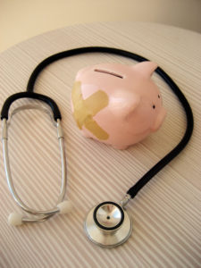 piggy bank and stethoscope